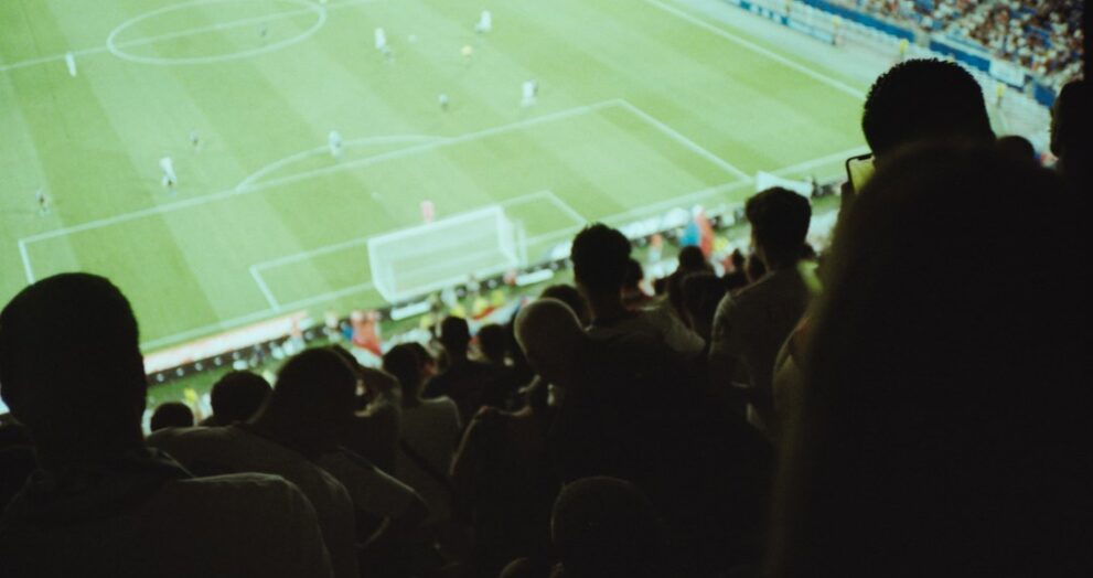 Fans in a stadium watching a European football final
