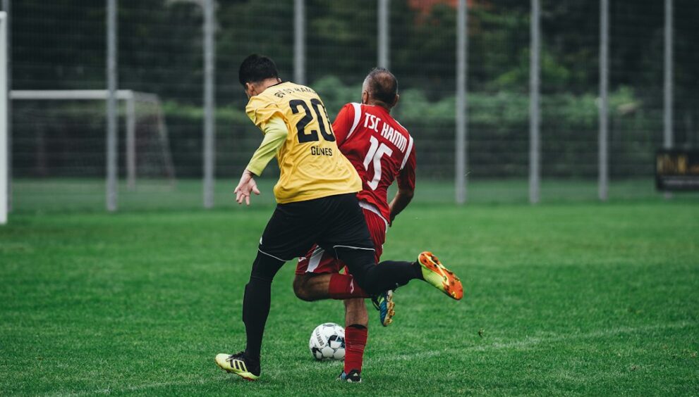 Professional footballer in action, illustrating record transfer fees