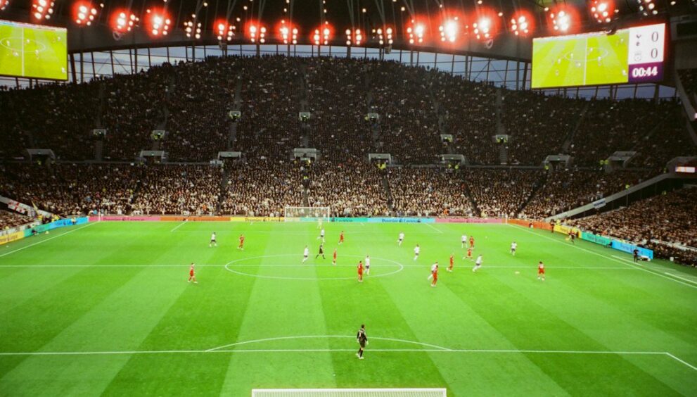 Packed football stadium during a Premier League style match